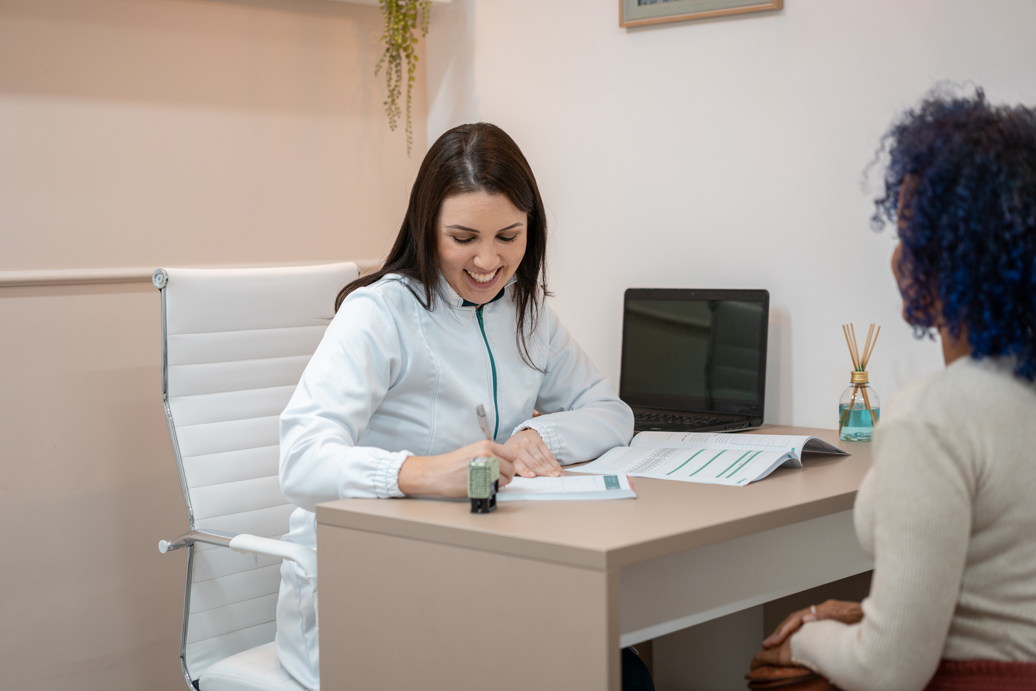 dentist and new associate signing the employment agreement.